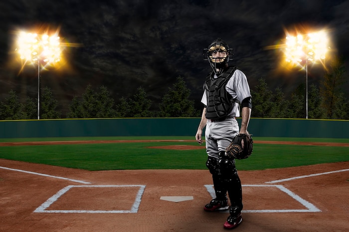 Catcher baseball player on a baseball stadium.