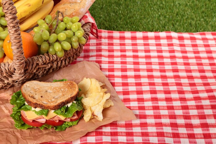 Picnic basket with sandwich and copy space