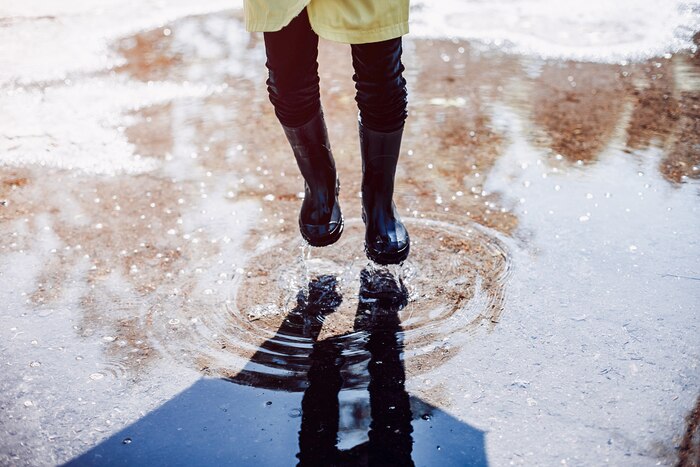 Cute kids plaiyng on a rainy day