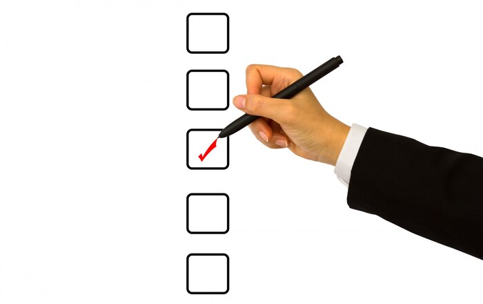 Businessman checking a box